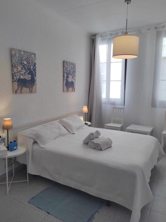 Posteľ alebo postele v izbe v ubytovaní Hostal Dragonflybcn