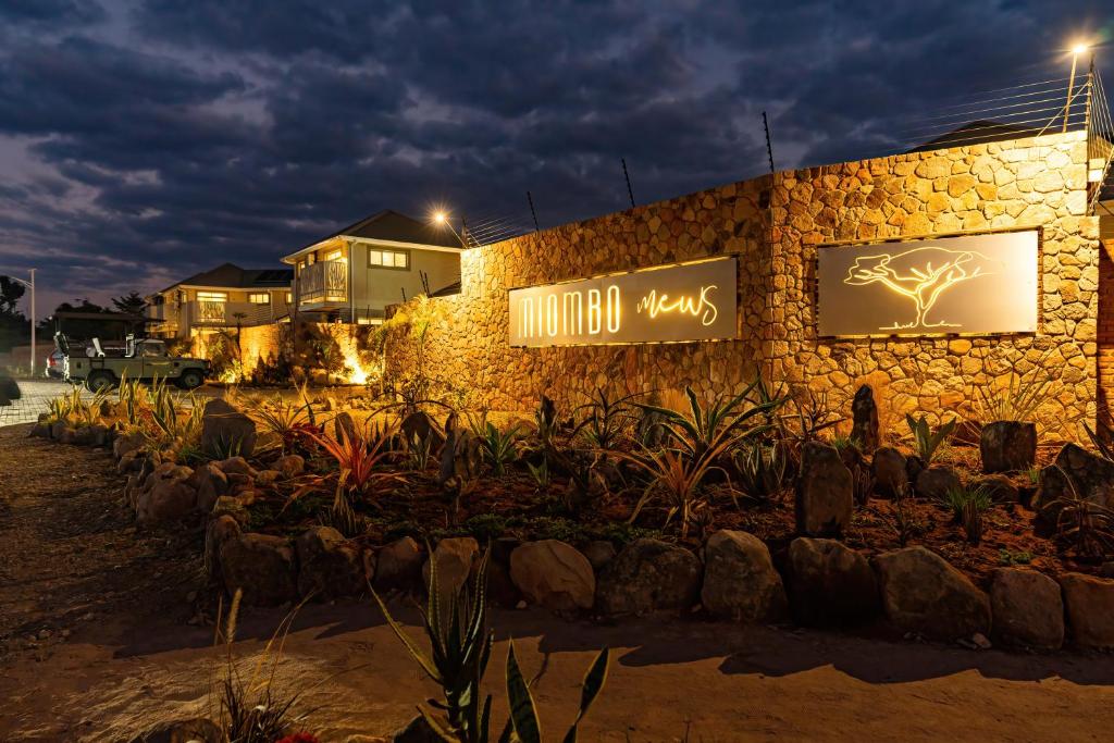 a building with a sign that reads immortal ways at Miombo Mews in Victoria Falls