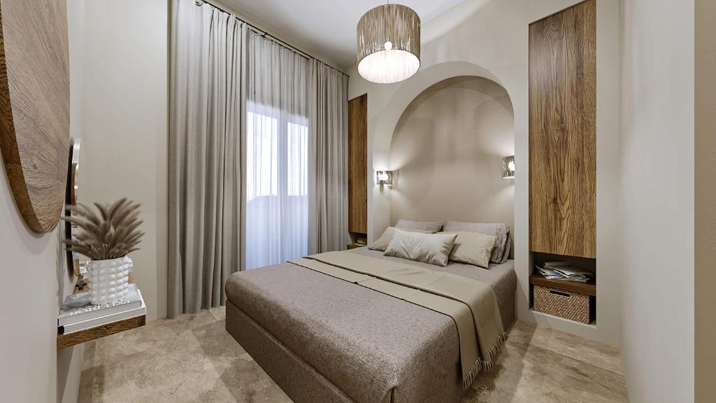 um quarto com uma cama e uma grande janela em Casa di Demezzo em Sitia