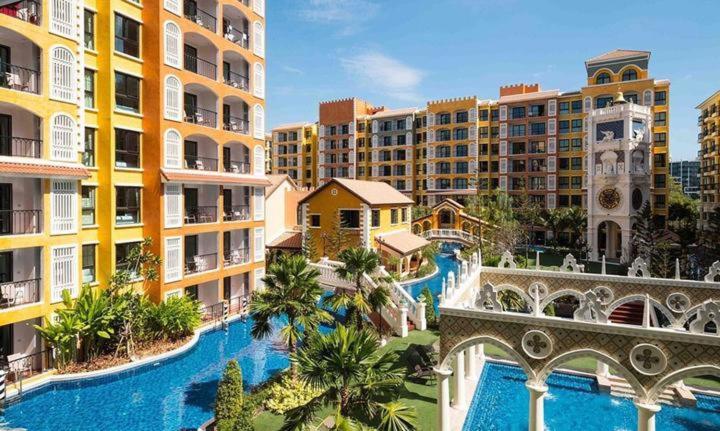 an aerial view of a resort with a pool and buildings at Venetiean Condo Pattaya by LJB719 in Jomtien Beach