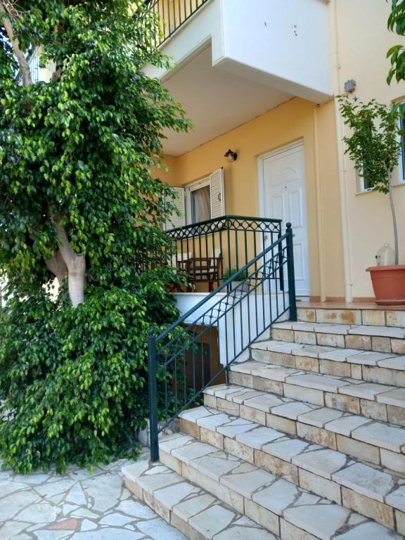 a house with stairs leading to the front door at ARETI4 in Petalidi