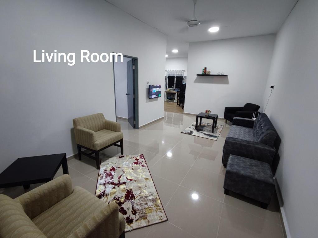 a living room with couches and chairs and a living room at 4A Home2Stay in Kota Bharu