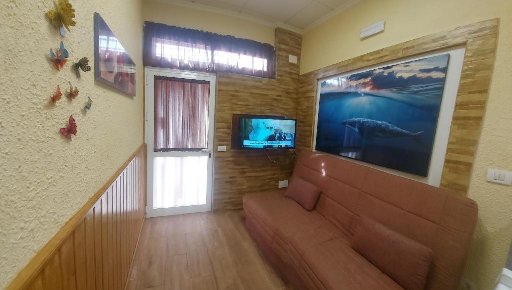 TV in/ali zabaviščno središče v nastanitvi Apartamentos Siboramar L15 Diego