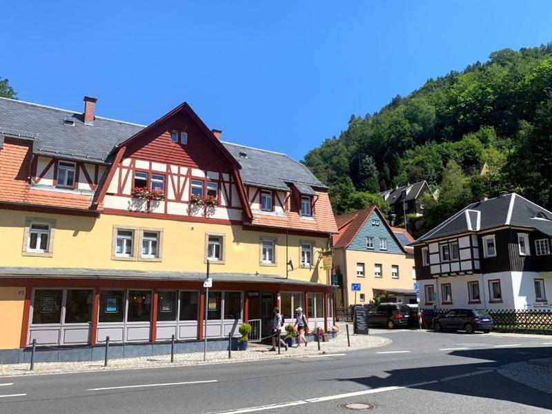 a group of buildings on the side of a street at Pension Grenzeck in Bad Schandau