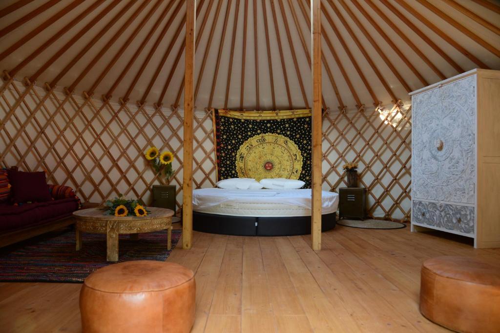 a room with a bed in a yurt at TENUTA IL GUERRIERO in Capestrano