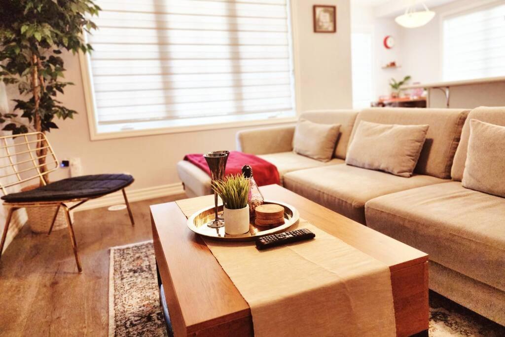 a living room with a couch and a coffee table at Cozy 4 bedrooms home Milton in Milton