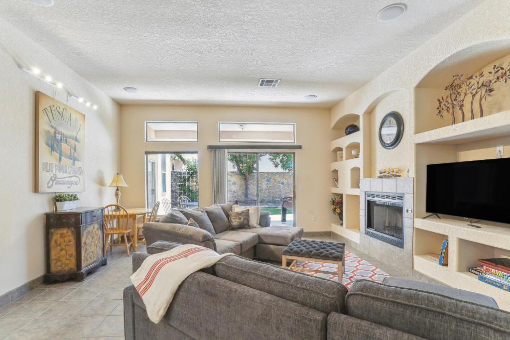 a living room with two couches and a tv at Las Cruces Vacation Rental Near Trails and Golf! in Las Cruces