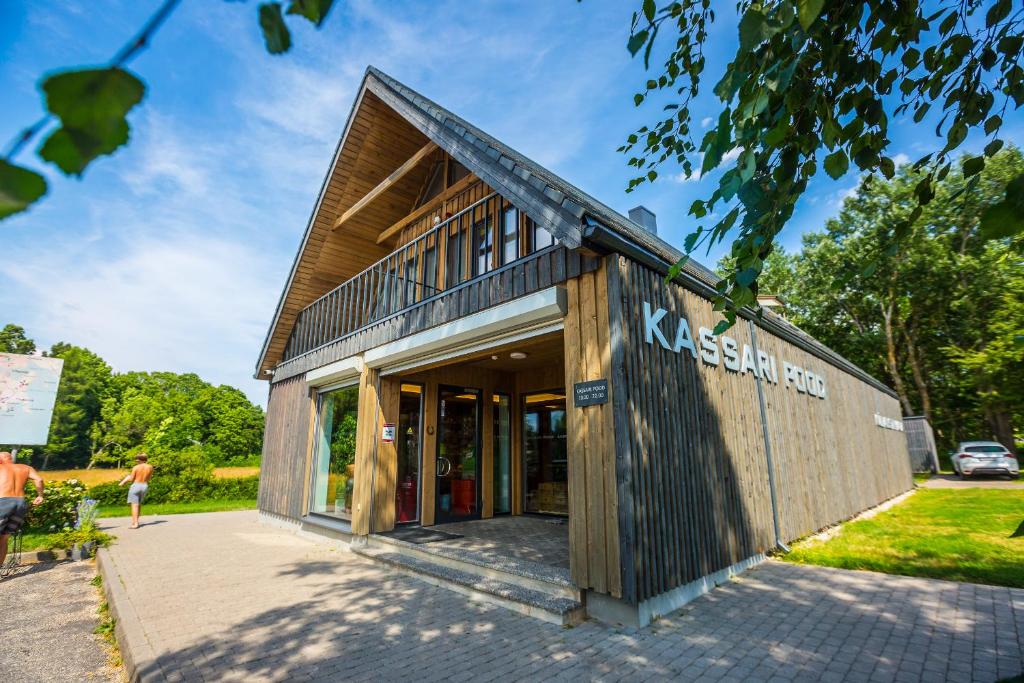 a building with a sign on the side of it at Kassari Apartment in Hiiumaa