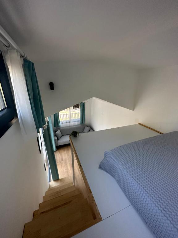 Postel nebo postele na pokoji v ubytování Gaia Tiny Houses Butik Hotel