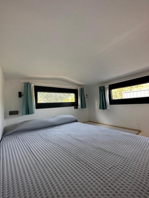 Postel nebo postele na pokoji v ubytování Gaia Tiny Houses Butik Hotel