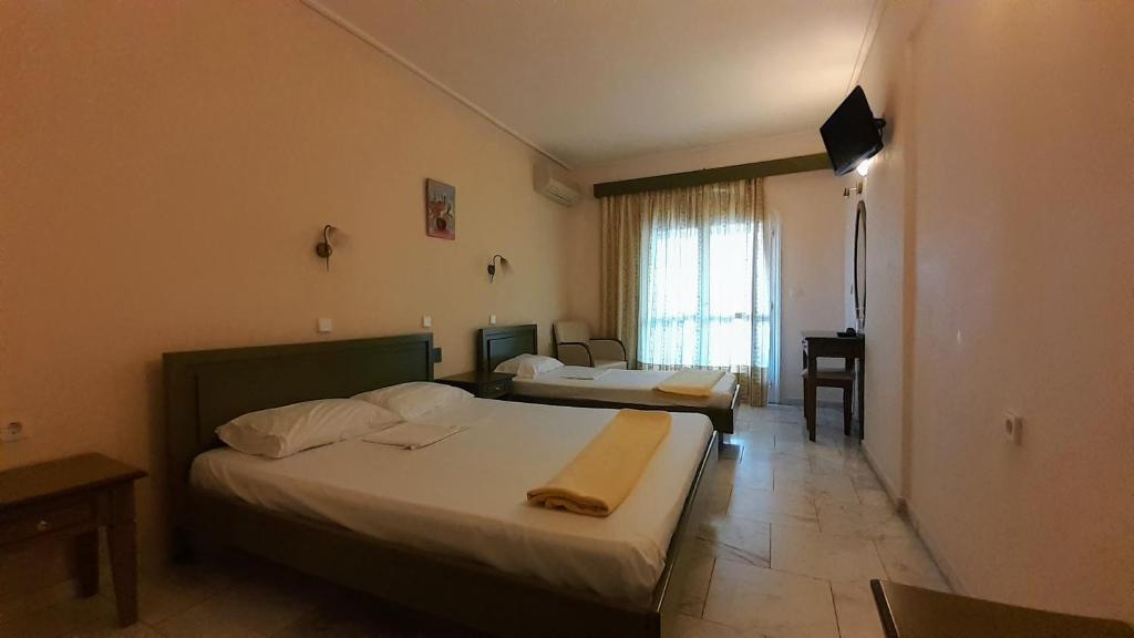 Tempat tidur dalam kamar di Hotel Niras