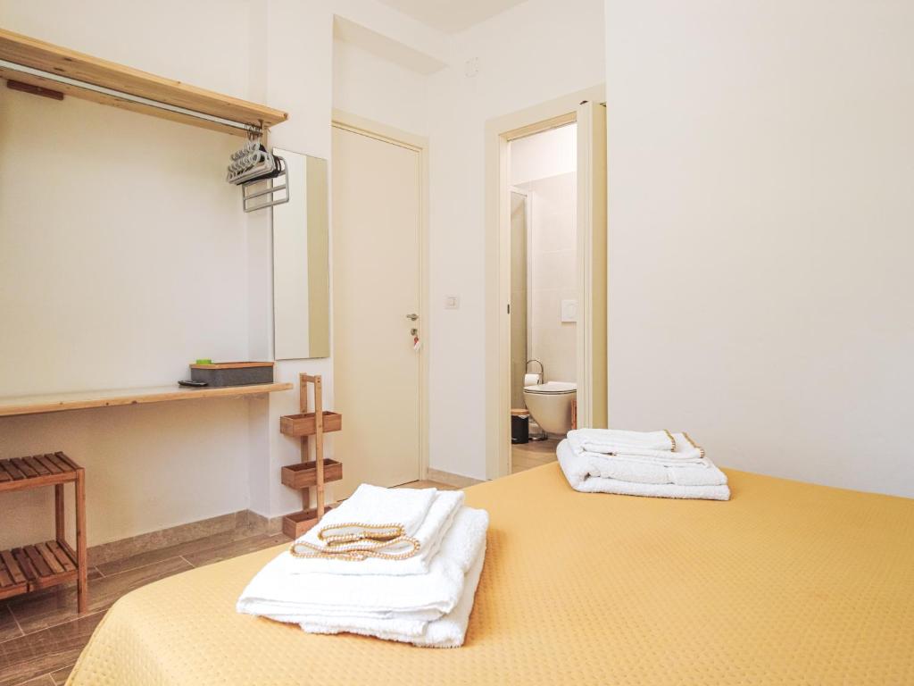 Postel nebo postele na pokoji v ubytování Villa Marianna