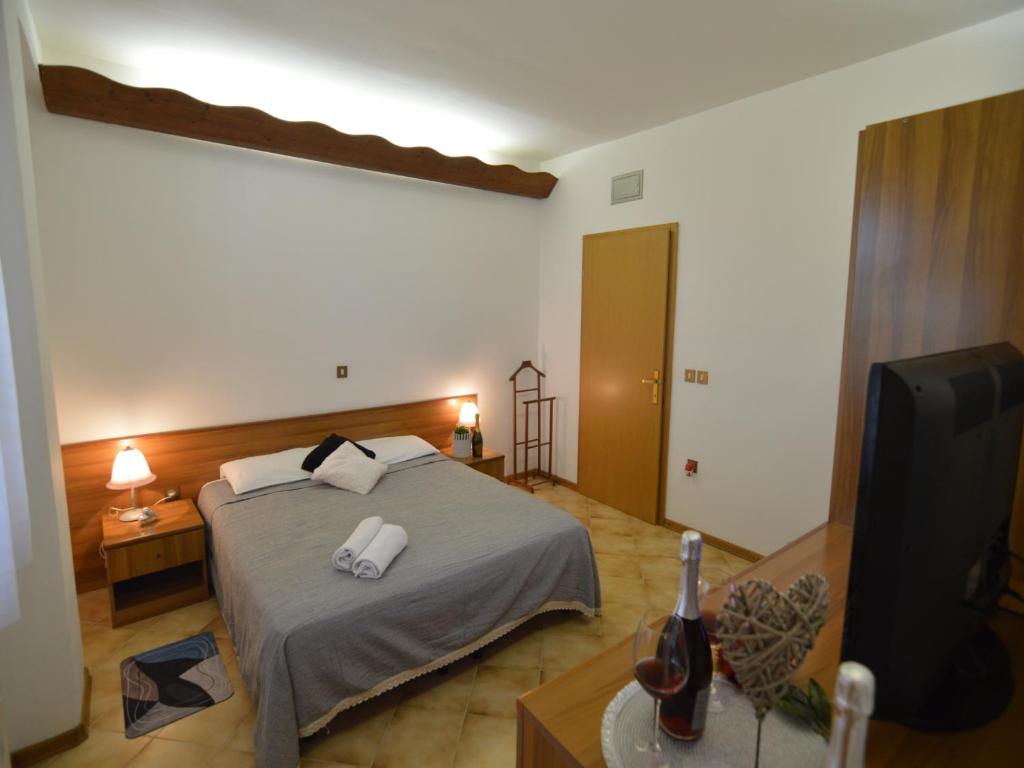 Postel nebo postele na pokoji v ubytování Bassanese Kastel