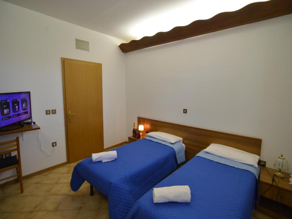Postel nebo postele na pokoji v ubytování Bassanese Kastel