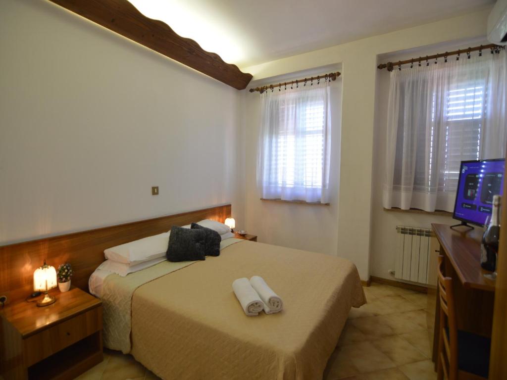 Postel nebo postele na pokoji v ubytování Bassanese Kastel