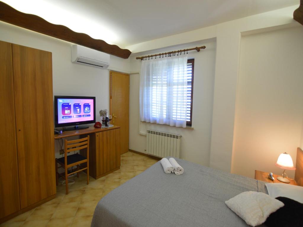 Postel nebo postele na pokoji v ubytování Bassanese Kastel