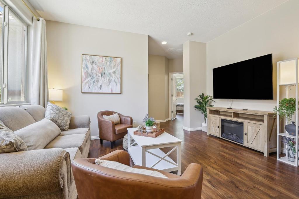 a living room with a couch and a tv at Welcoming Mesquite Condo with Pool Access! in Mesquite