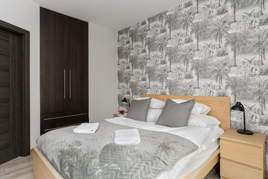Posteľ alebo postele v izbe v ubytovaní P&O Serviced Apartments Siedmiogrodzka III