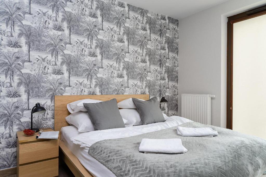 Posteľ alebo postele v izbe v ubytovaní P&O Serviced Apartments Siedmiogrodzka III