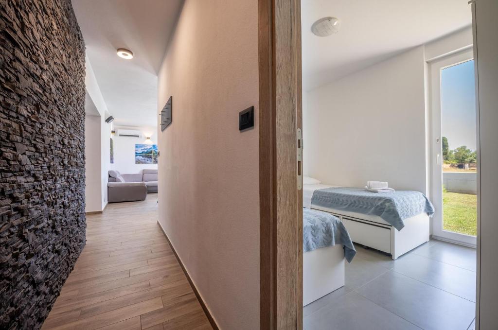 Posteľ alebo postele v izbe v ubytovaní Vacation house Ana