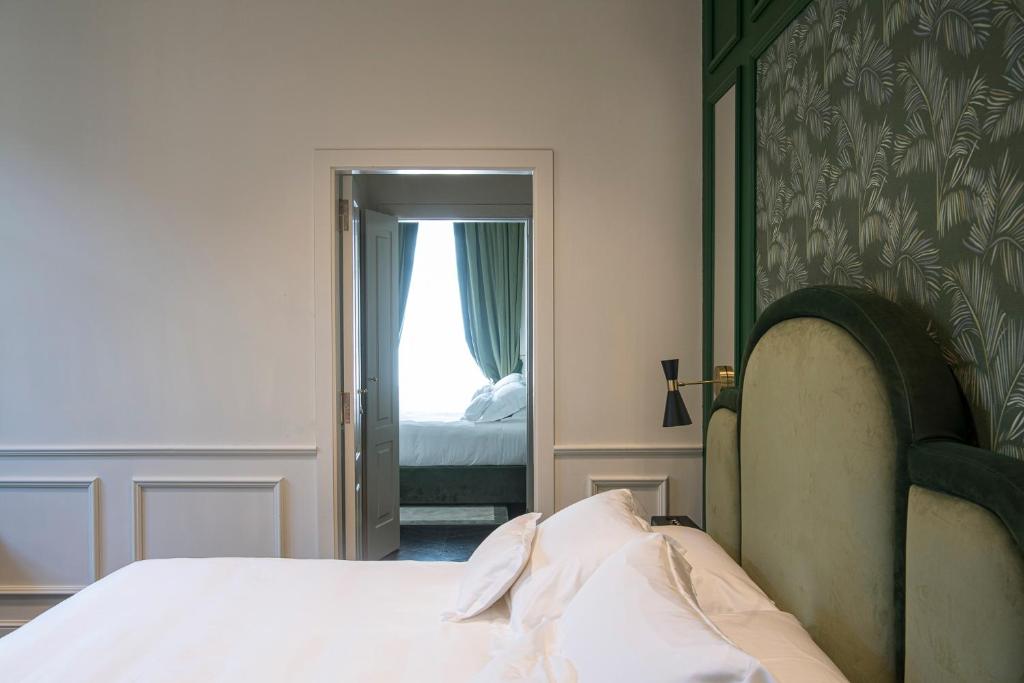 A bed or beds in a room at Hotel La Gemma