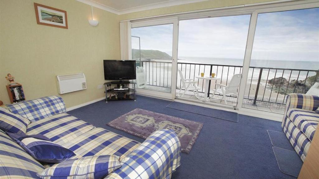 a living room with two couches and a balcony at Redcliffe Apartments G in Bishopston