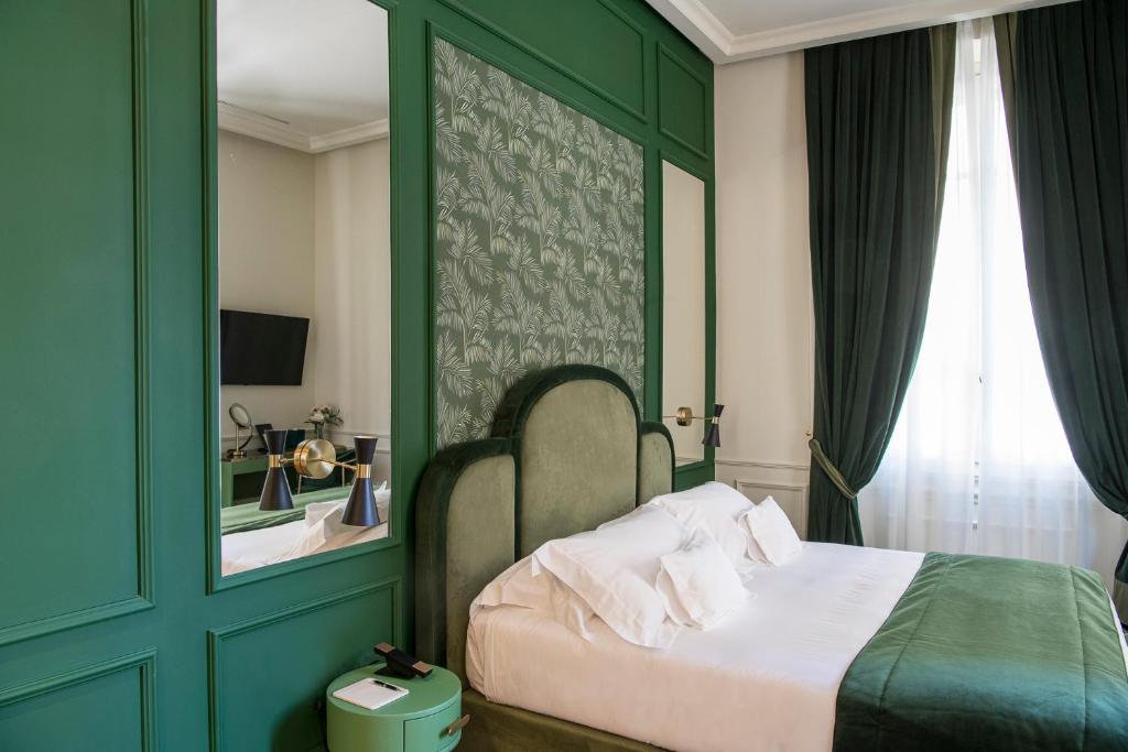 A bed or beds in a room at Hotel La Gemma