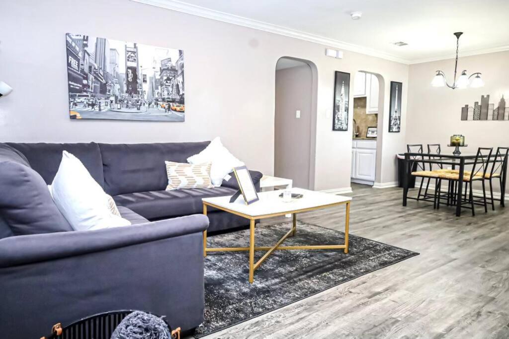 a living room with a couch and a table at Comfy Two-Bedroom Apartment in Arlington in Arlington