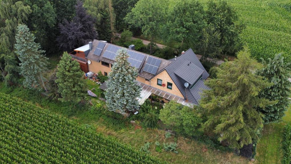 an aerial view of a house with a solar roof at Gabis Ferienwohnung Bendingbostel in Bendingbostel