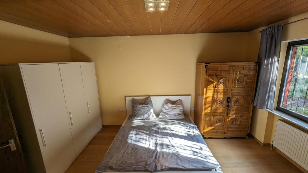 Postel nebo postele na pokoji v ubytování FeWo Sonnenschein Bungalow