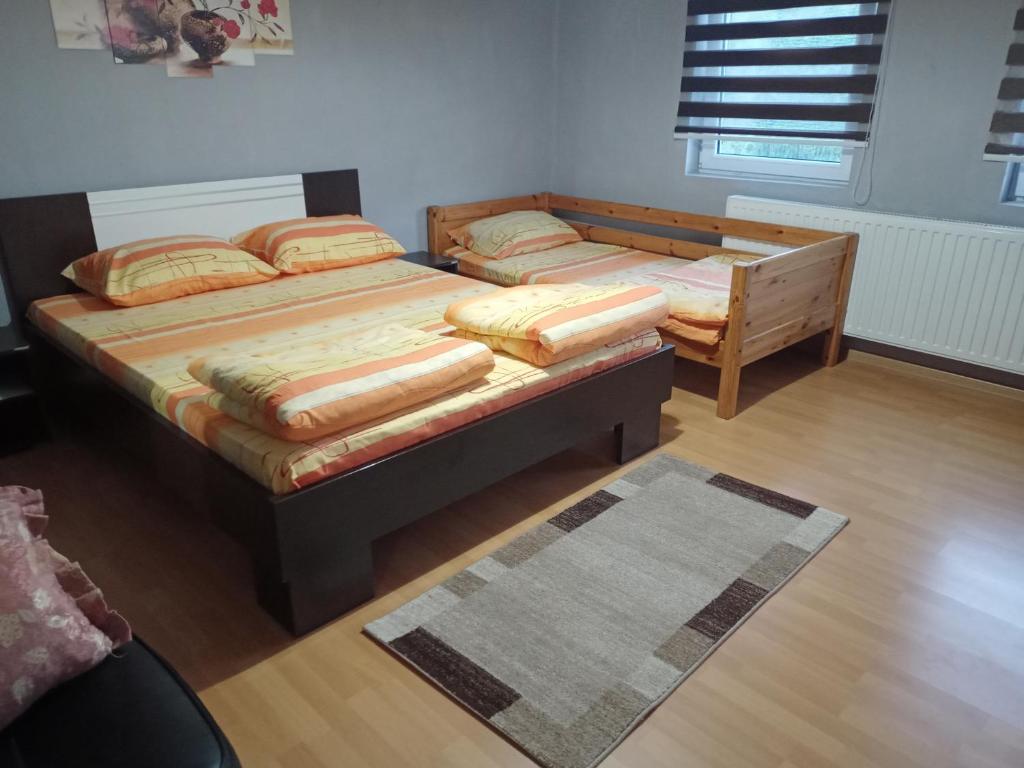 Postel nebo postele na pokoji v ubytování Kuca Jablansko Polje