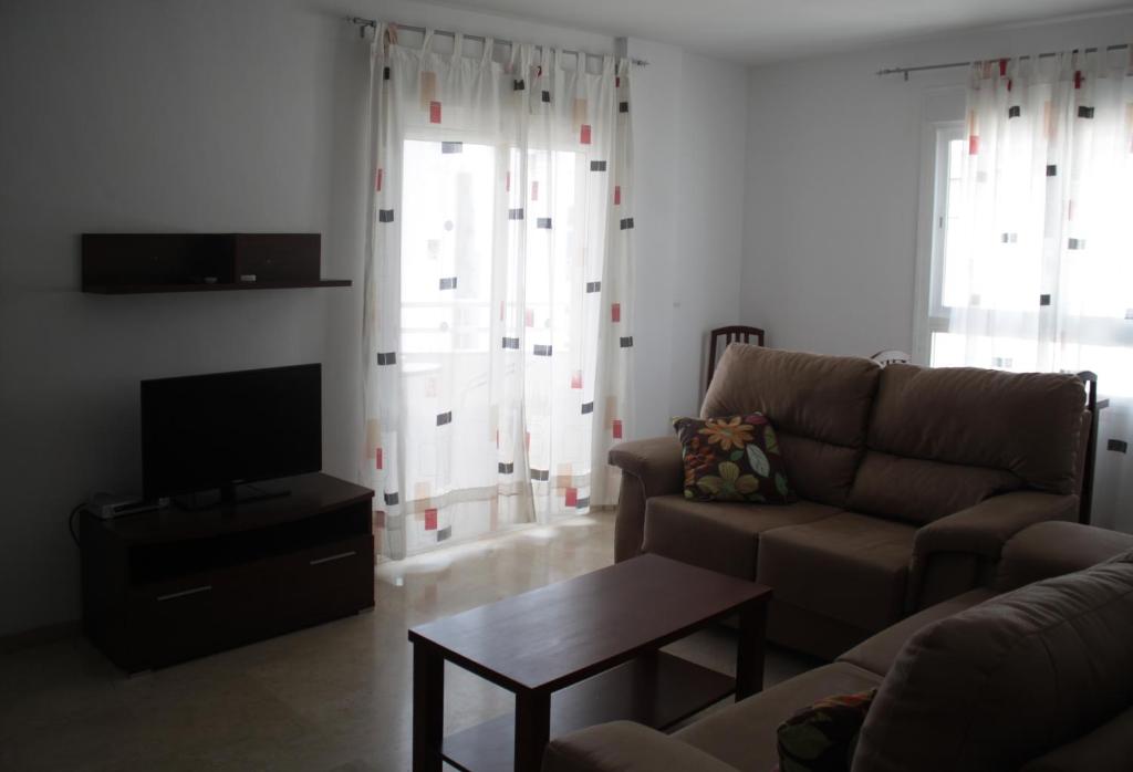 Telewizja i/lub zestaw kina domowego w obiekcie Apartamentos Turísticos Fercomar