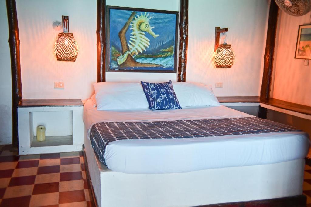Postel nebo postele na pokoji v ubytování Hotel Isla Del Pirata