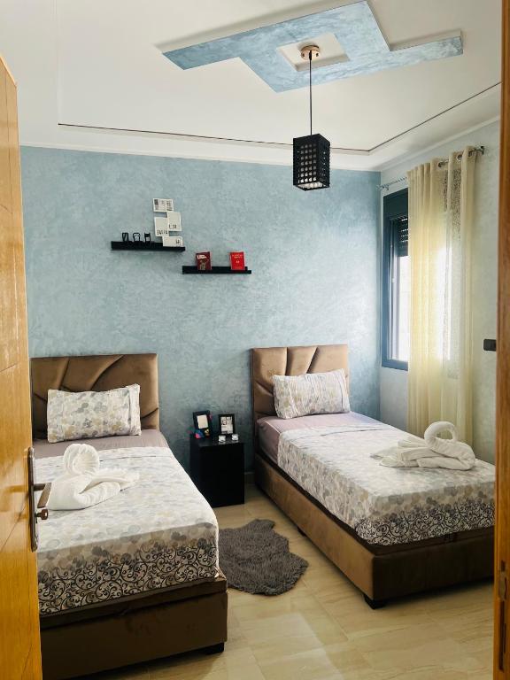 Postel nebo postele na pokoji v ubytování Appartement INES Saidia