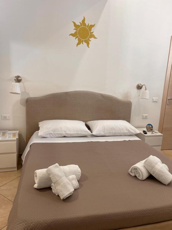 Postel nebo postele na pokoji v ubytování Esse House's Noto