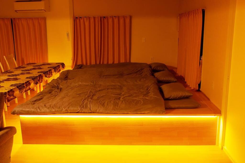 Postel nebo postele na pokoji v ubytování guesthouse みつば