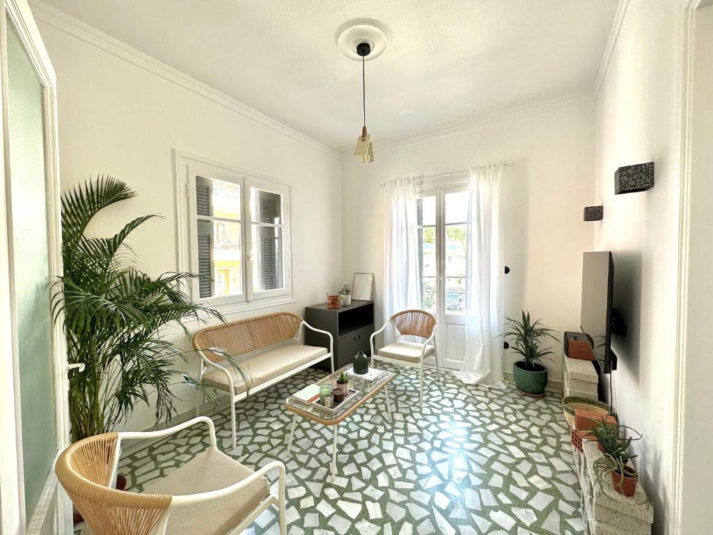 a living room with a couch and chairs at The Lassis 15 House in Argostoli