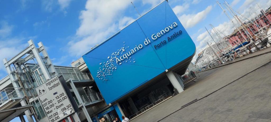 a large blue sign on the side of a building at APPARTAMENTO SUL MARE KATE in Genoa