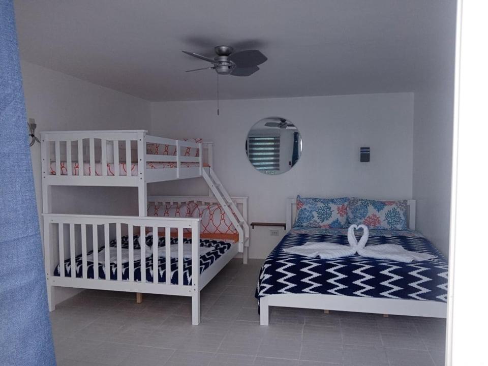 Postel nebo postele na pokoji v ubytování 1888 Beach Resort