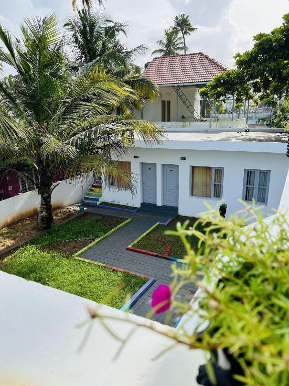 Zahrada ubytování Chameleon Beach Resort, Cherai