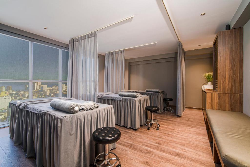 Postel nebo postele na pokoji v ubytování Luxtery Hotel & Spa