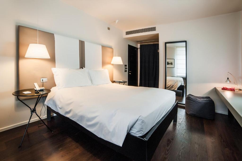Postel nebo postele na pokoji v ubytování Hotel Casa Poli