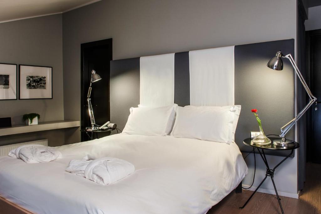 Postel nebo postele na pokoji v ubytování Hotel Casa Poli