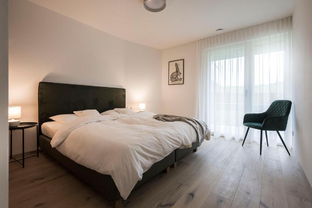 Postel nebo postele na pokoji v ubytování Astor Apartments