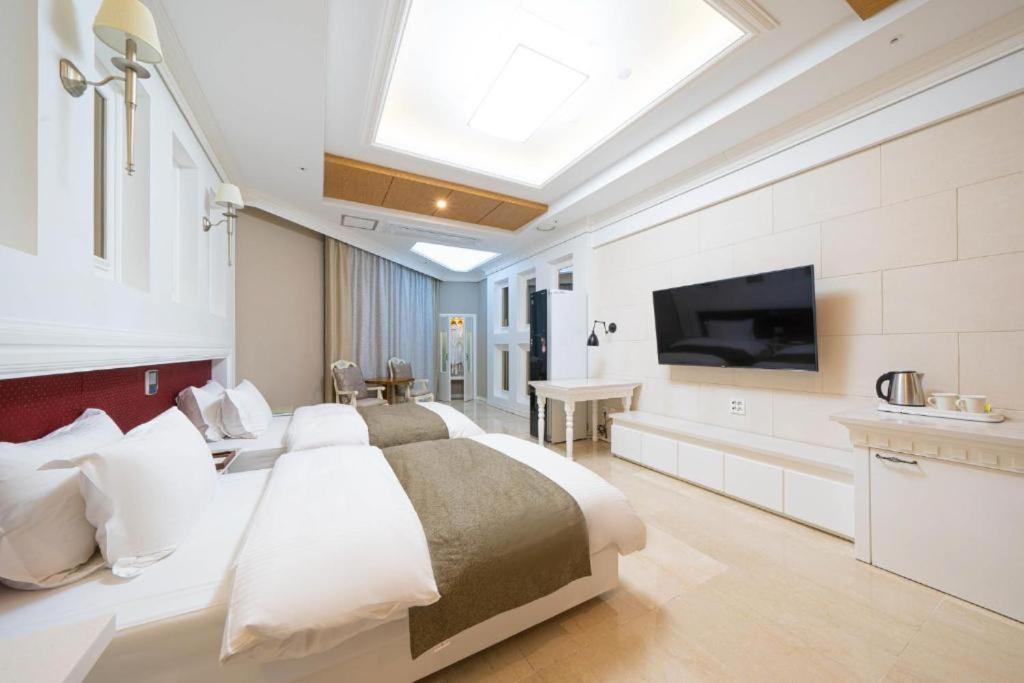 Postel nebo postele na pokoji v ubytování Hotel Core