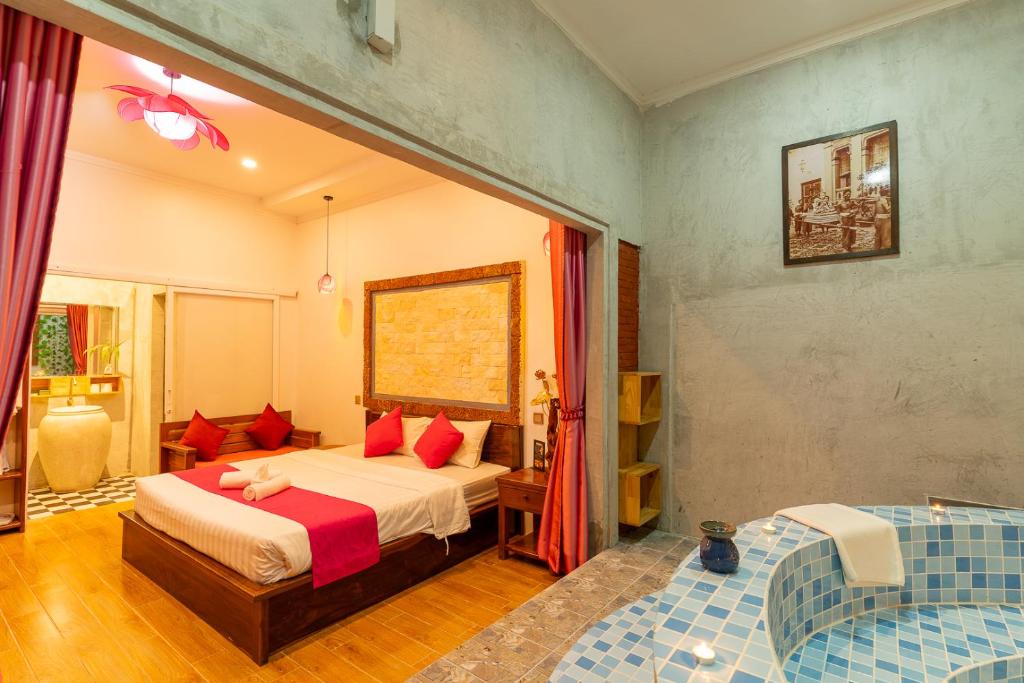 Postel nebo postele na pokoji v ubytování Angkor Rithy Boutique