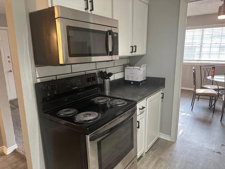 A kitchen or kitchenette at Walk to AT&T Stadium! Free parking on Premises