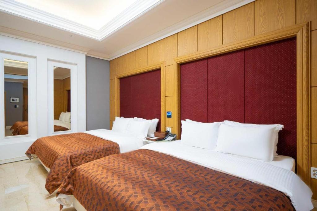 Postel nebo postele na pokoji v ubytování Hotel Core