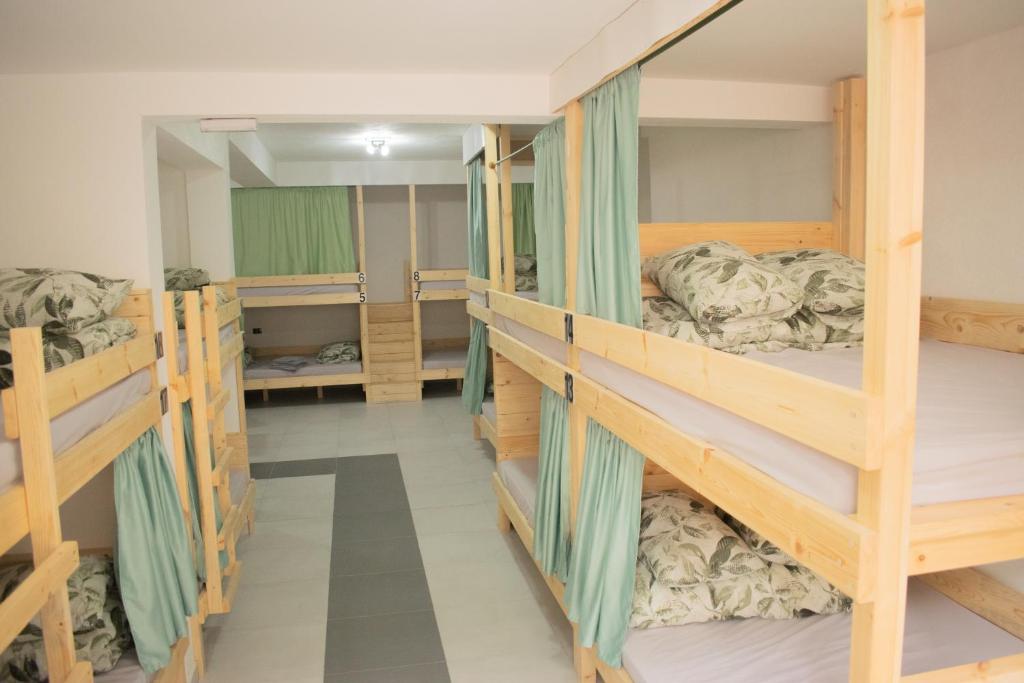 a room with four bunk beds in it at Hostel Kovači in Sarajevo
