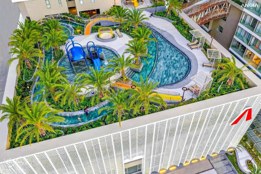 an overhead view of a pool at a resort at The Song Vung Tau By Abogo in Vung Tau